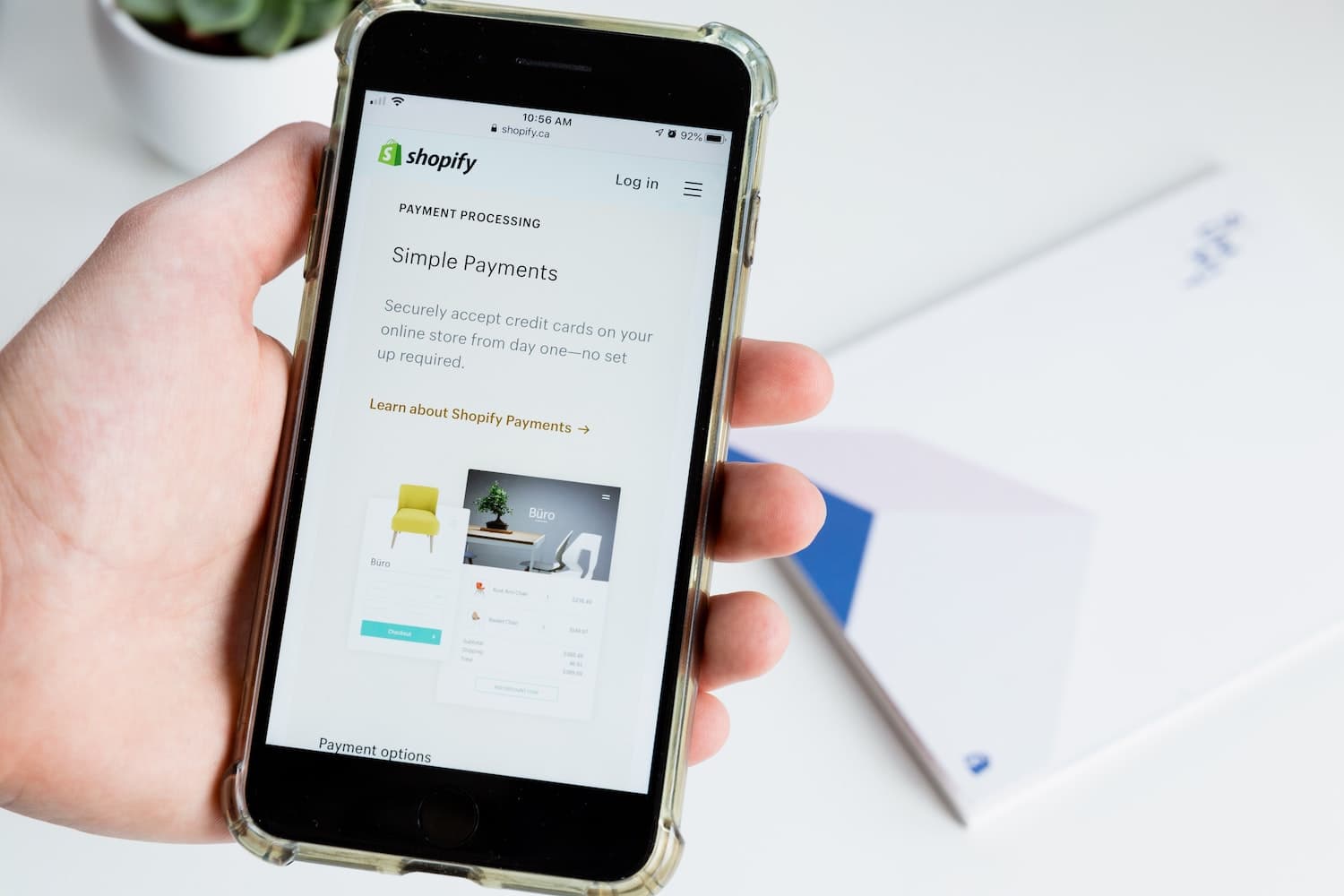 Smartphone screen showing Shopify's Payment Processing page for online store checkout