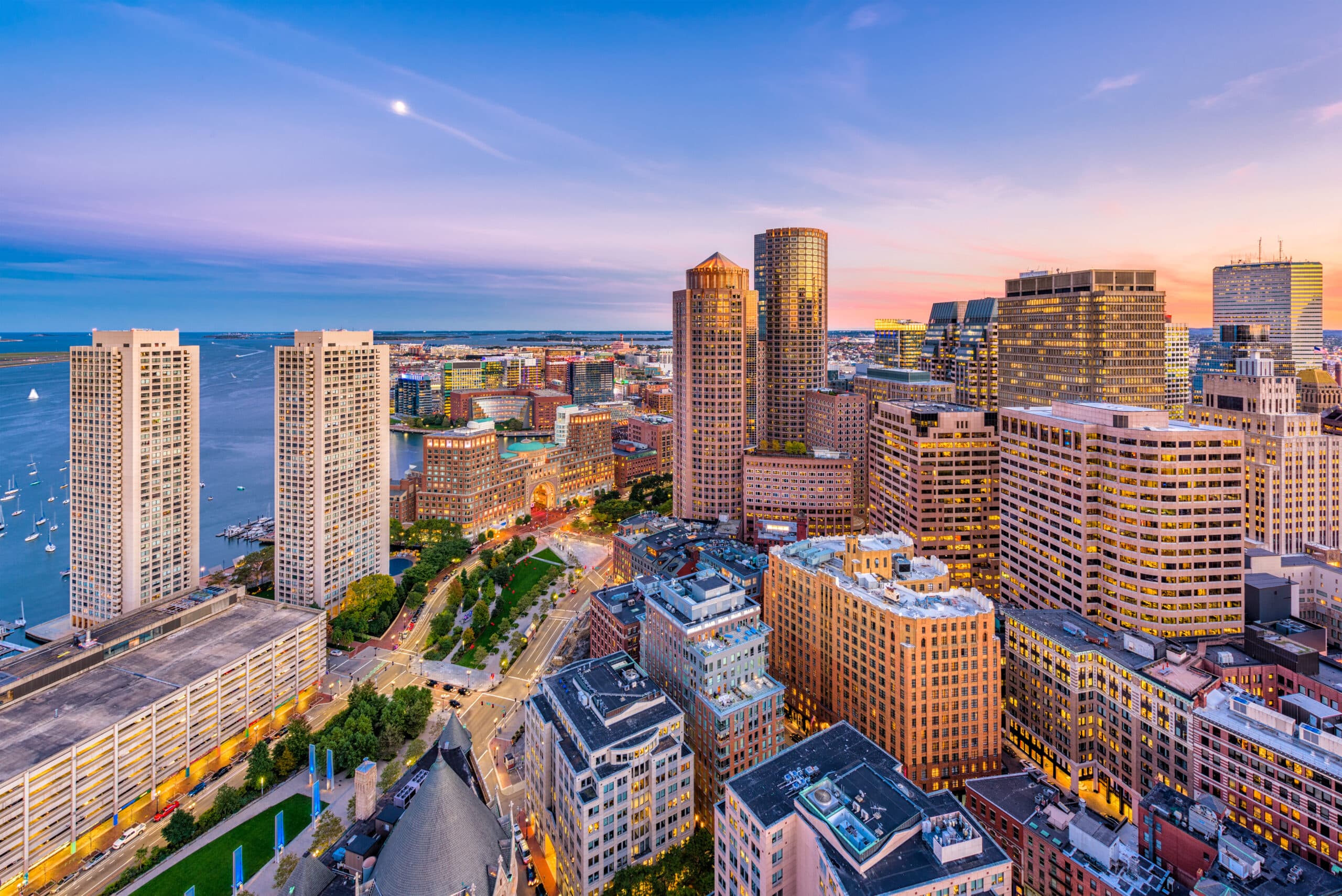 Aerial dusk view of downtown Boston skyline and waterfront