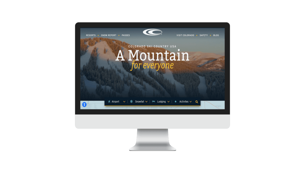 Colorado Ski Country USA homepage mockup on desktop monitor with navigation menu