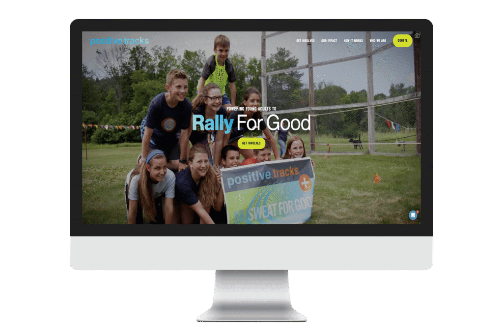 Desktop mockup of Positive Tracks homepage displaying 'Rally For Good' hero banner