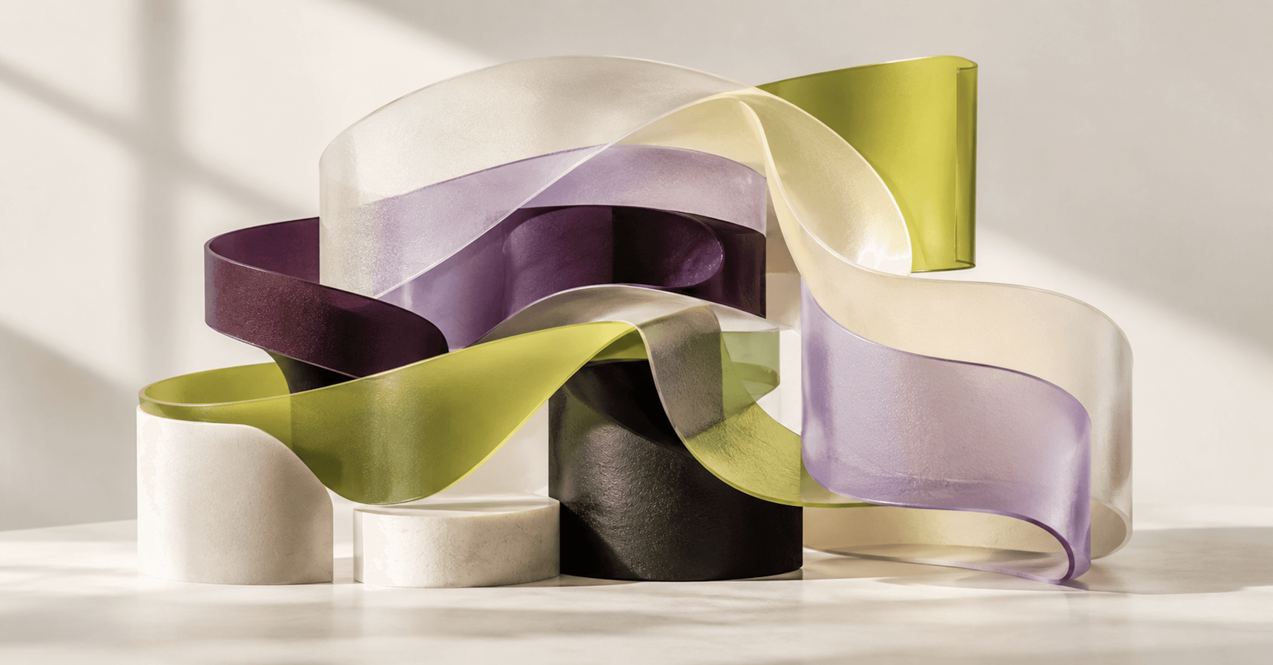 Abstract sculptural arrangement of translucent cream, lavender, plum, and chartreuse ribbons intertwined around geometric forms, representing the flexible, modular design capabilities of Shopify’s Horizon theme